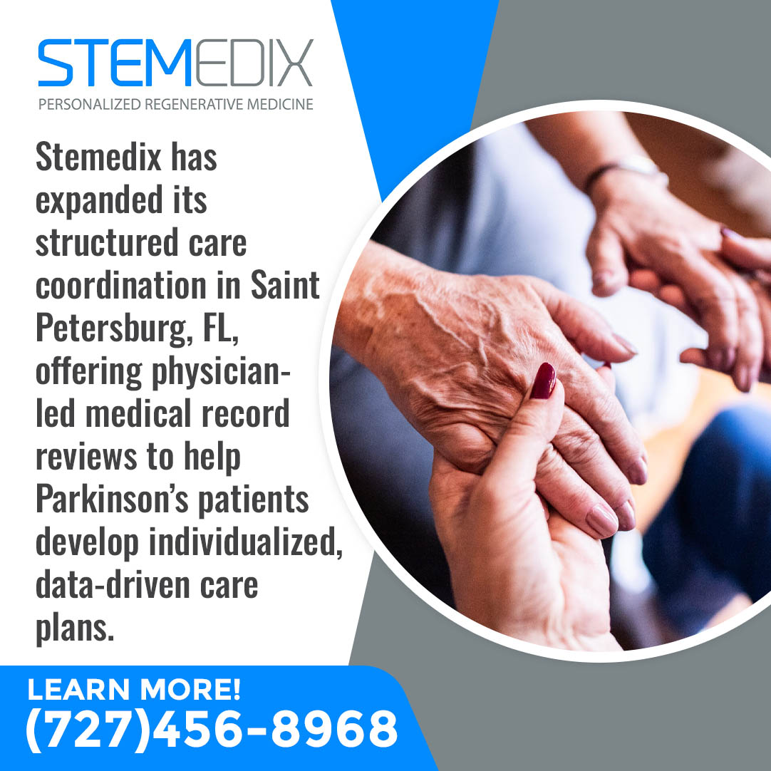 Caregiver holding the hands of an elderly patient during supportive medical care